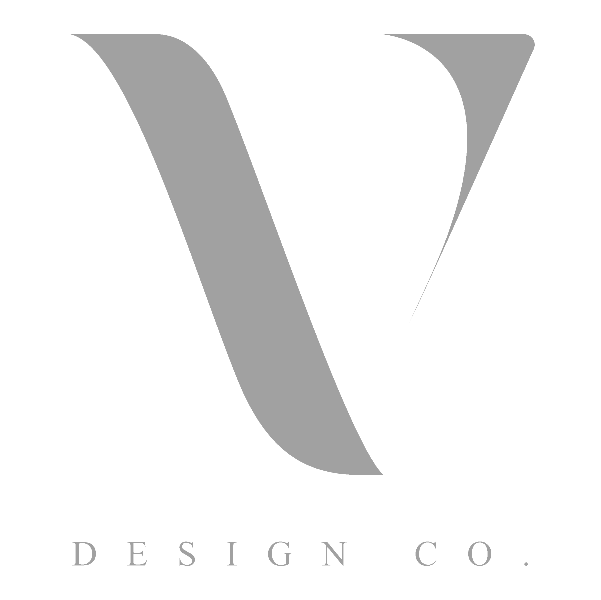 Logo of V Design Co. featuring a stylized, grey, uppercase "V" above the text "DESIGN CO." in grey font on a white background.